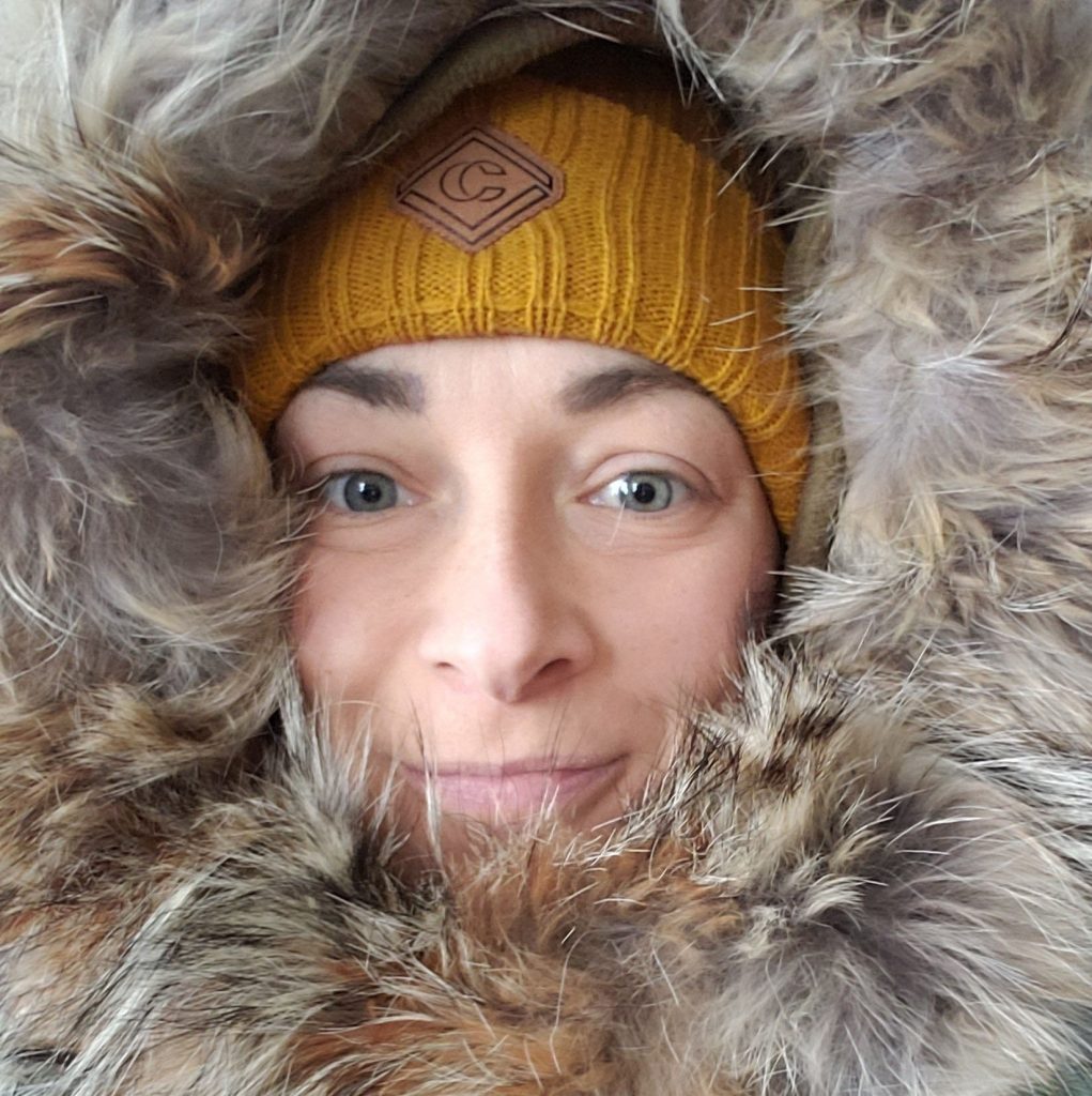 Person in fur-lined winter coat