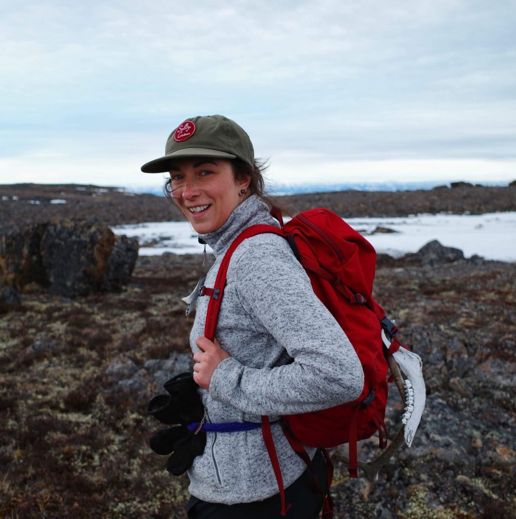 Hiker with red backpack in nature