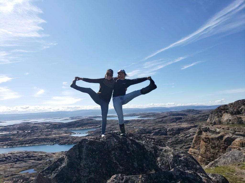 Two people posing on a mountain