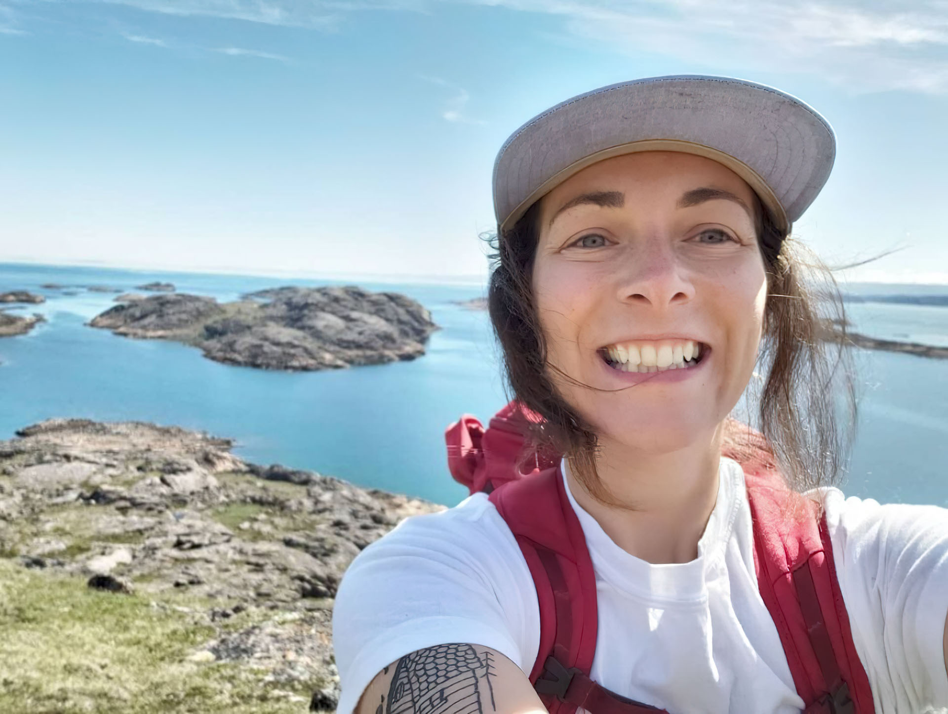 Smiling person with scenic background