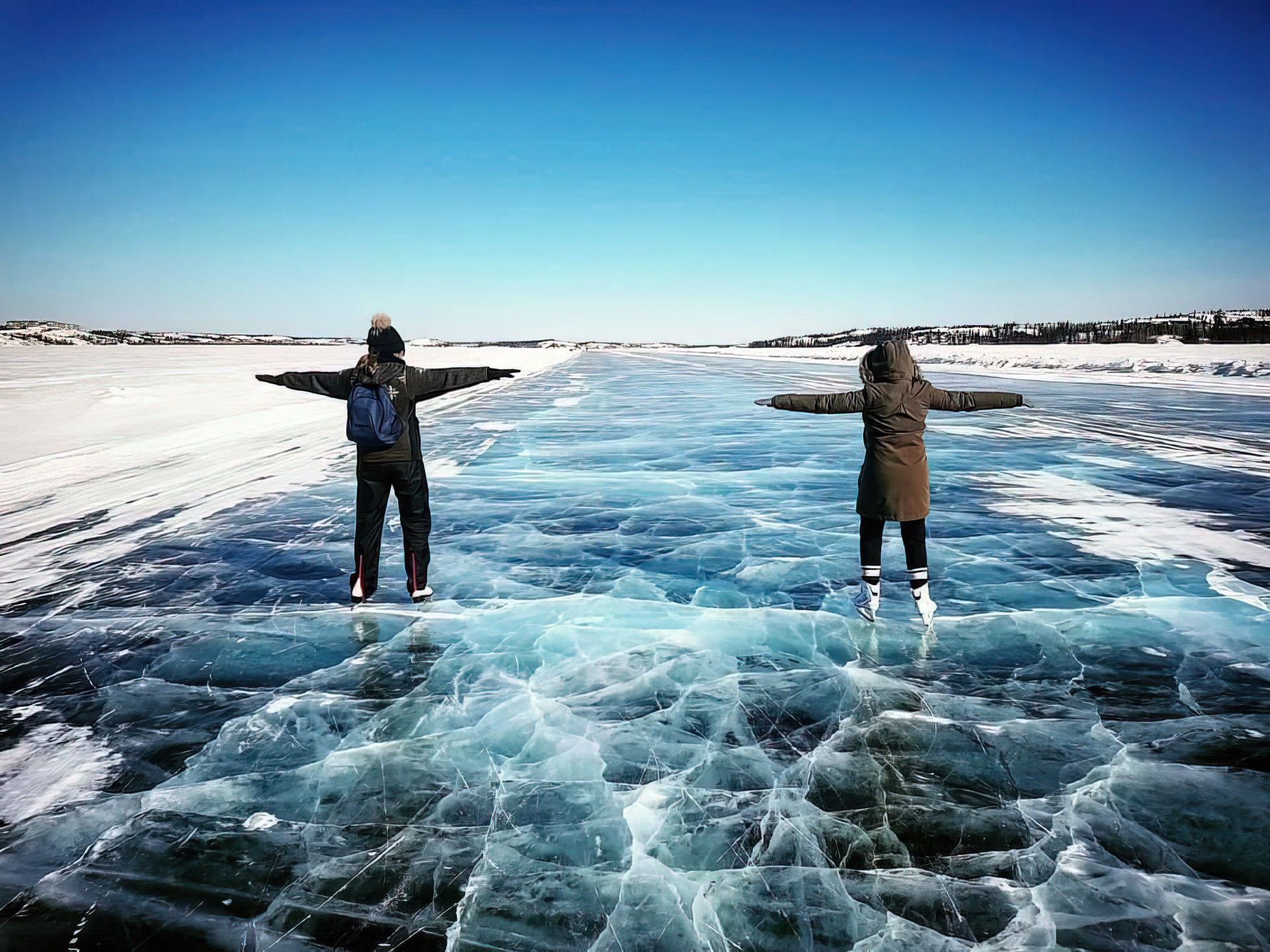 Two people on frozen ice surface