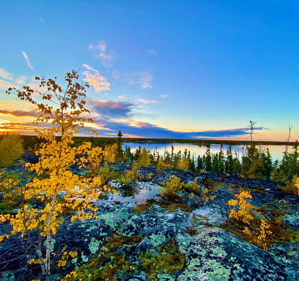 Vibrant sunset over serene landscape