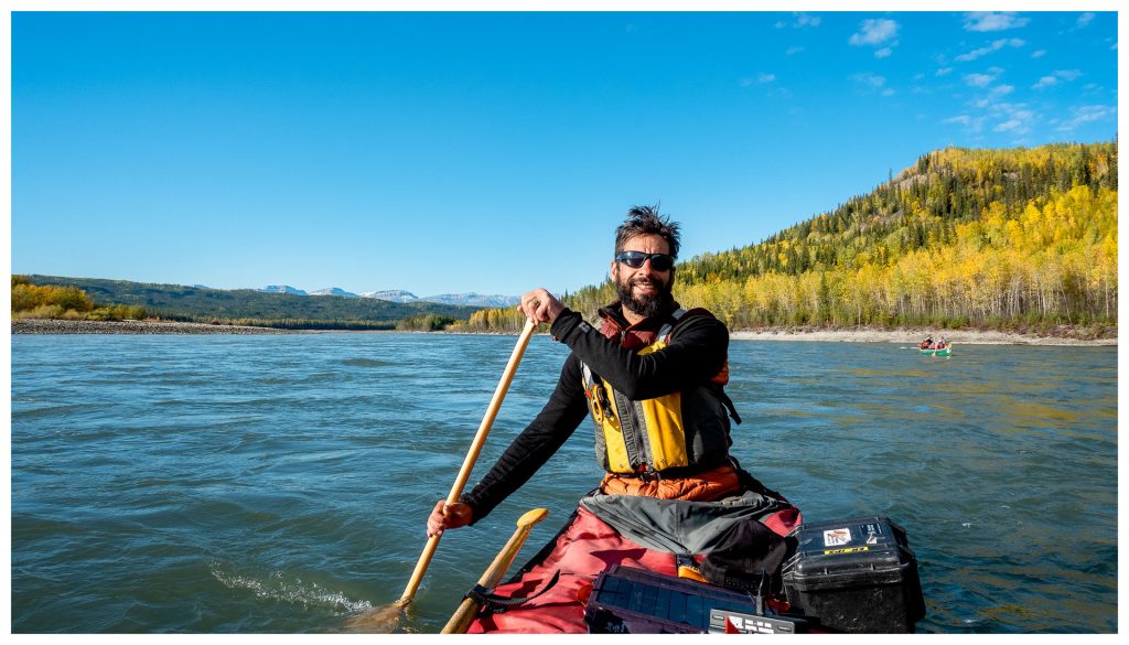 Man paddling on a river