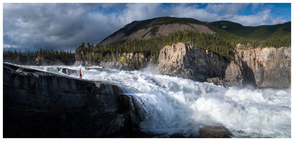 Powerful waterfall with rugged landscape