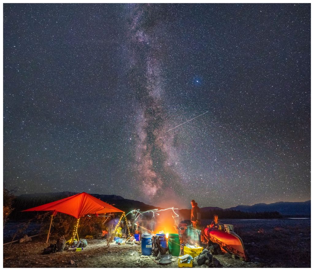 Camping under a starry night sky
