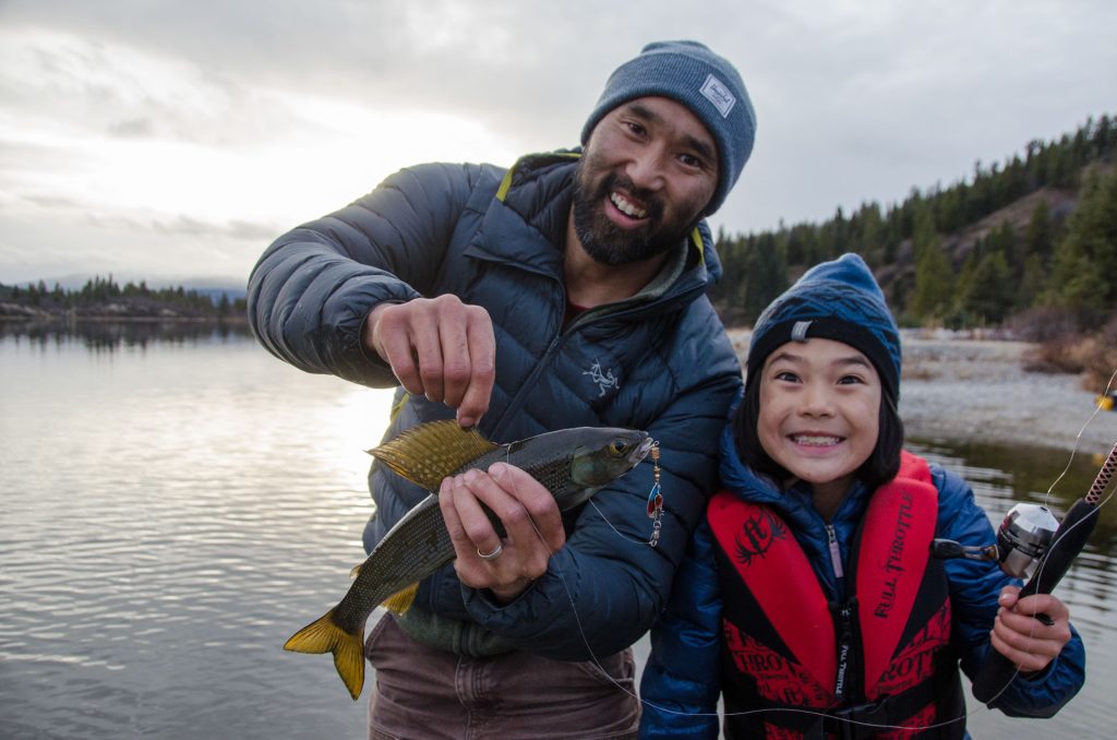 Man and child fishing together