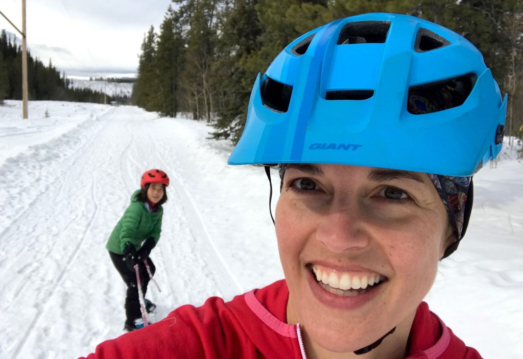 Two women enjoying winter activities outdoors
