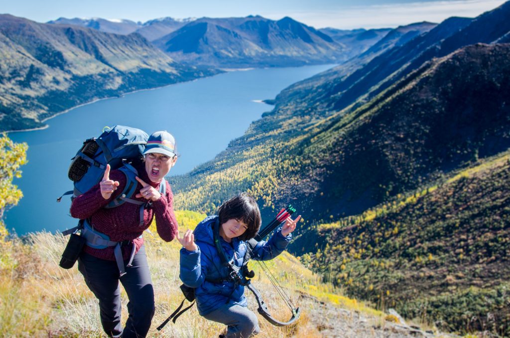 Two hikers posing with backpacks.
