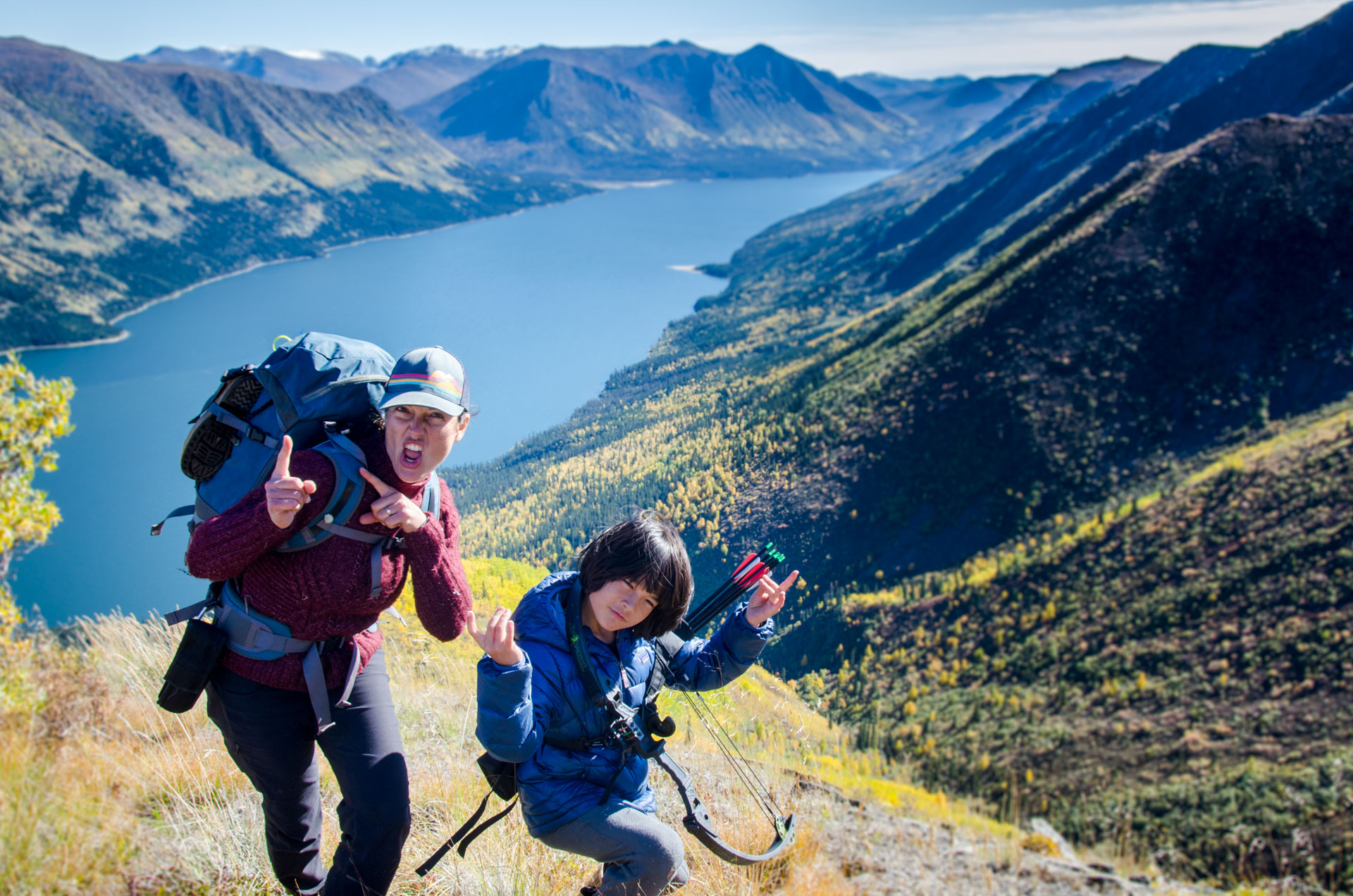 Two hikers posing with backpacks.