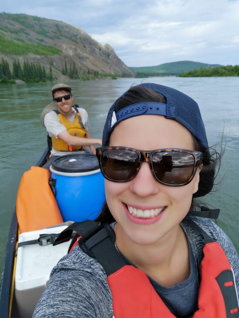 Two people kayaking on a river