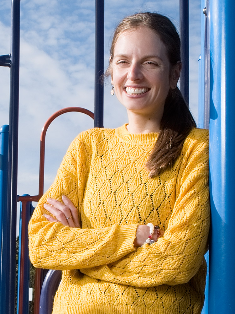 Smiling woman in yellow sweater