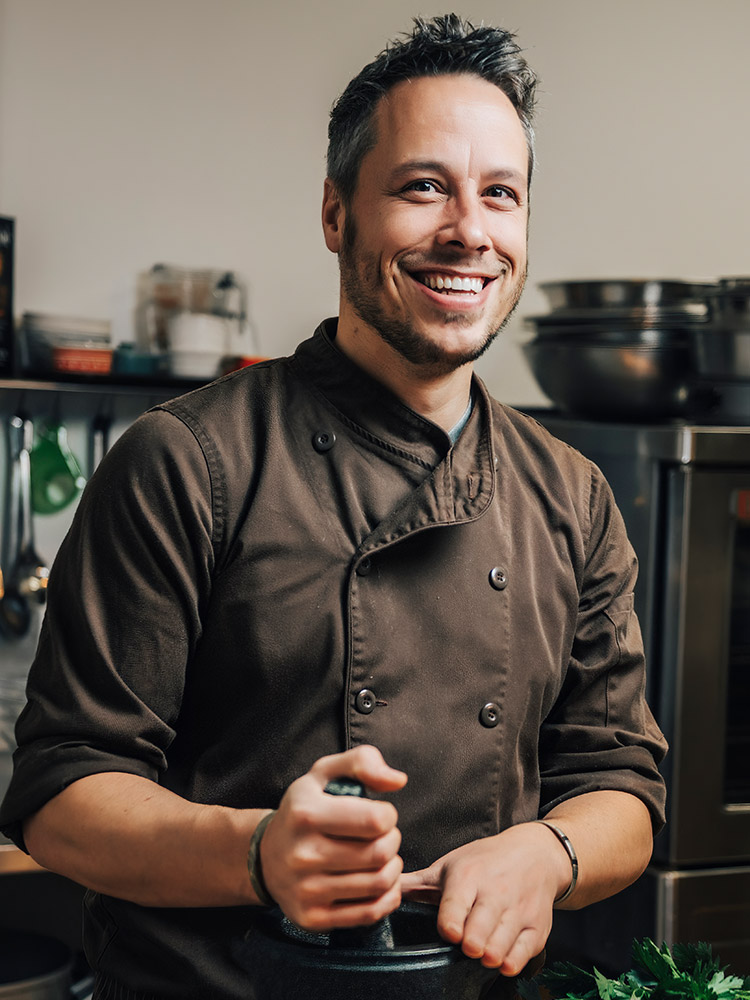Smiling chef in a kitchen setting