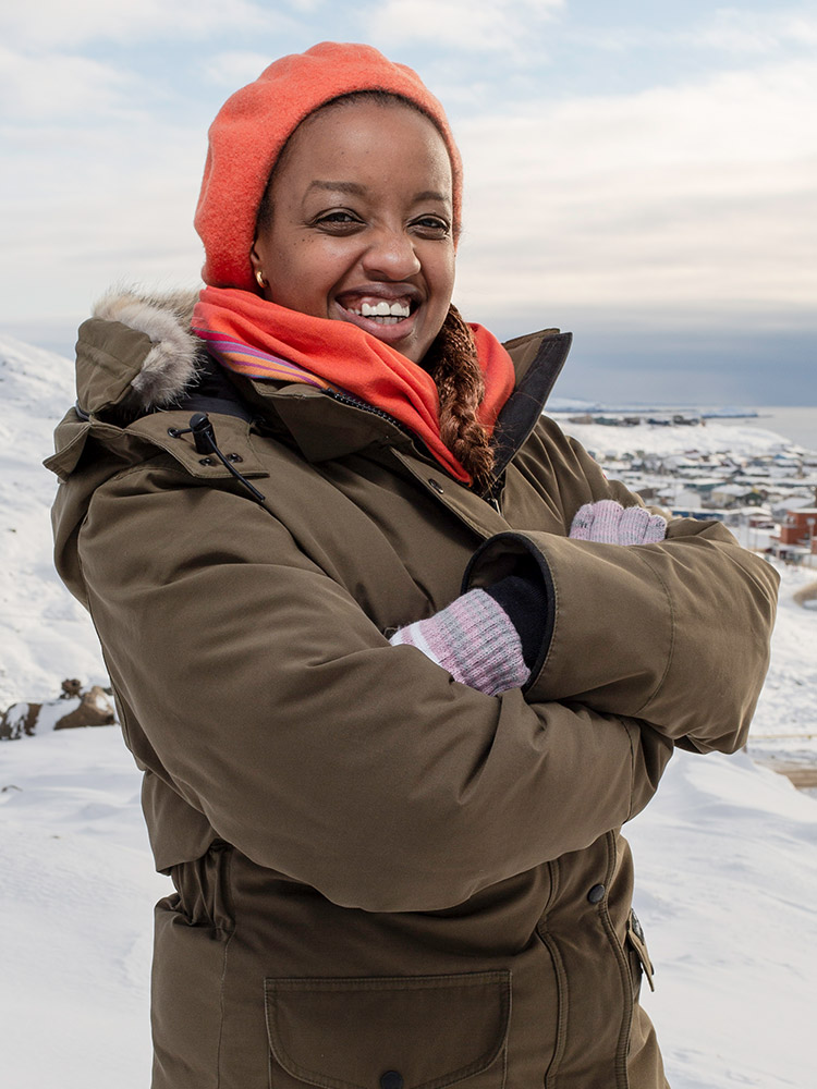 Smiling woman in winter clothing outdoors