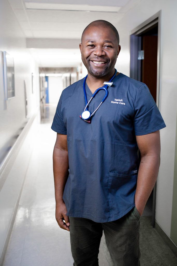 Smiling healthcare worker in scrubs