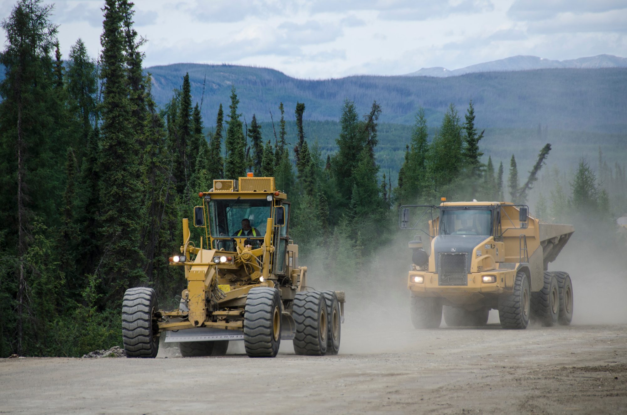 Construction vehicles on a dirt road