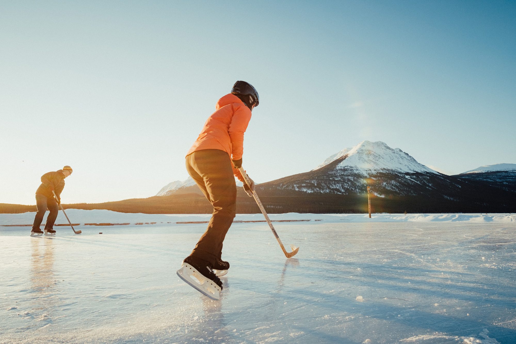 Two skaters on frozen lake