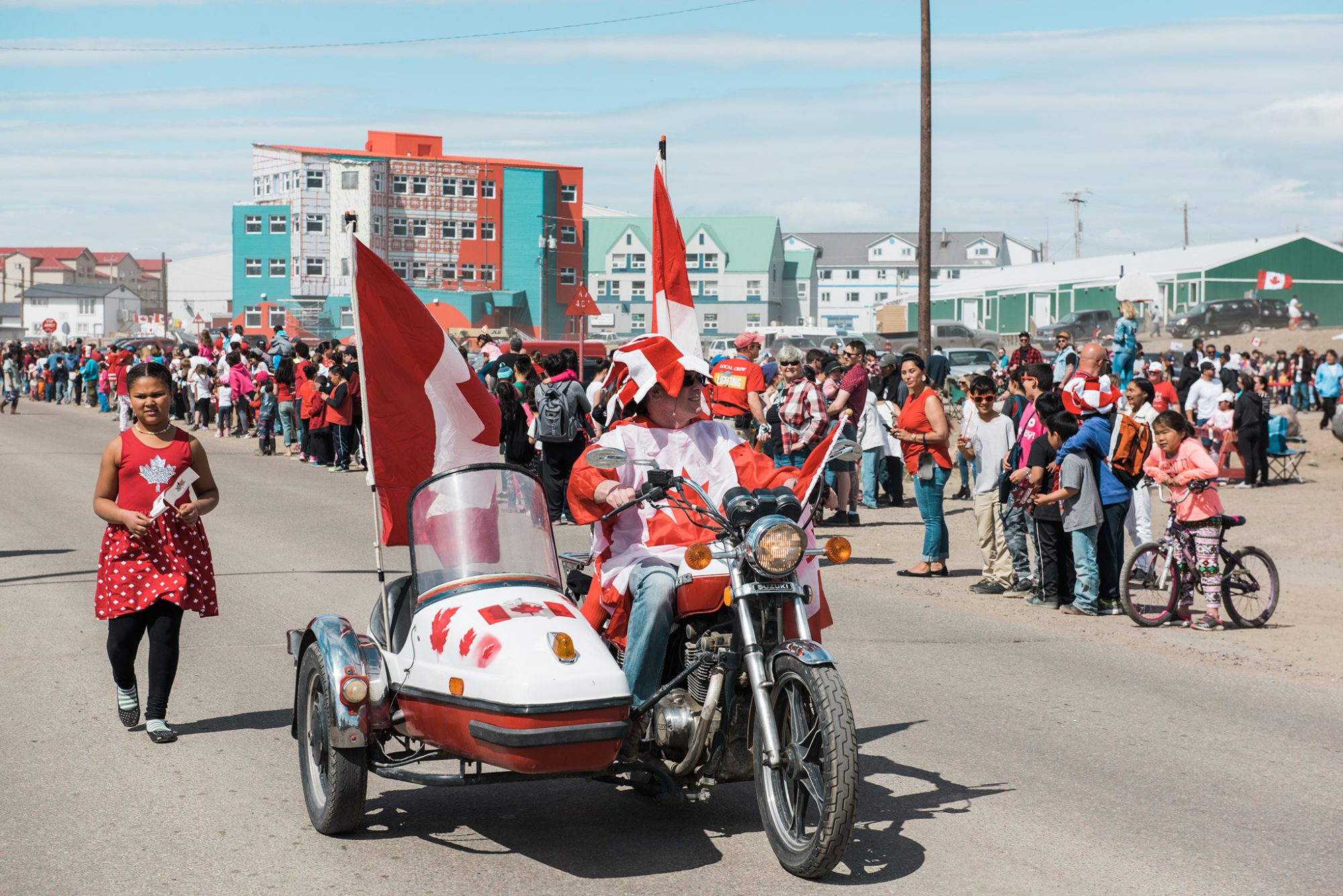 Parade with Canadian flags and people