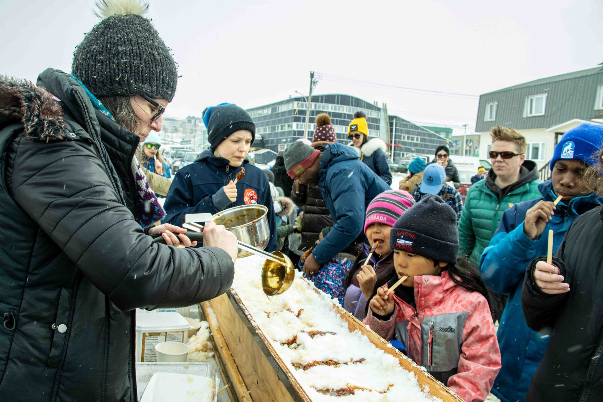 People enjoying a winter festival treat