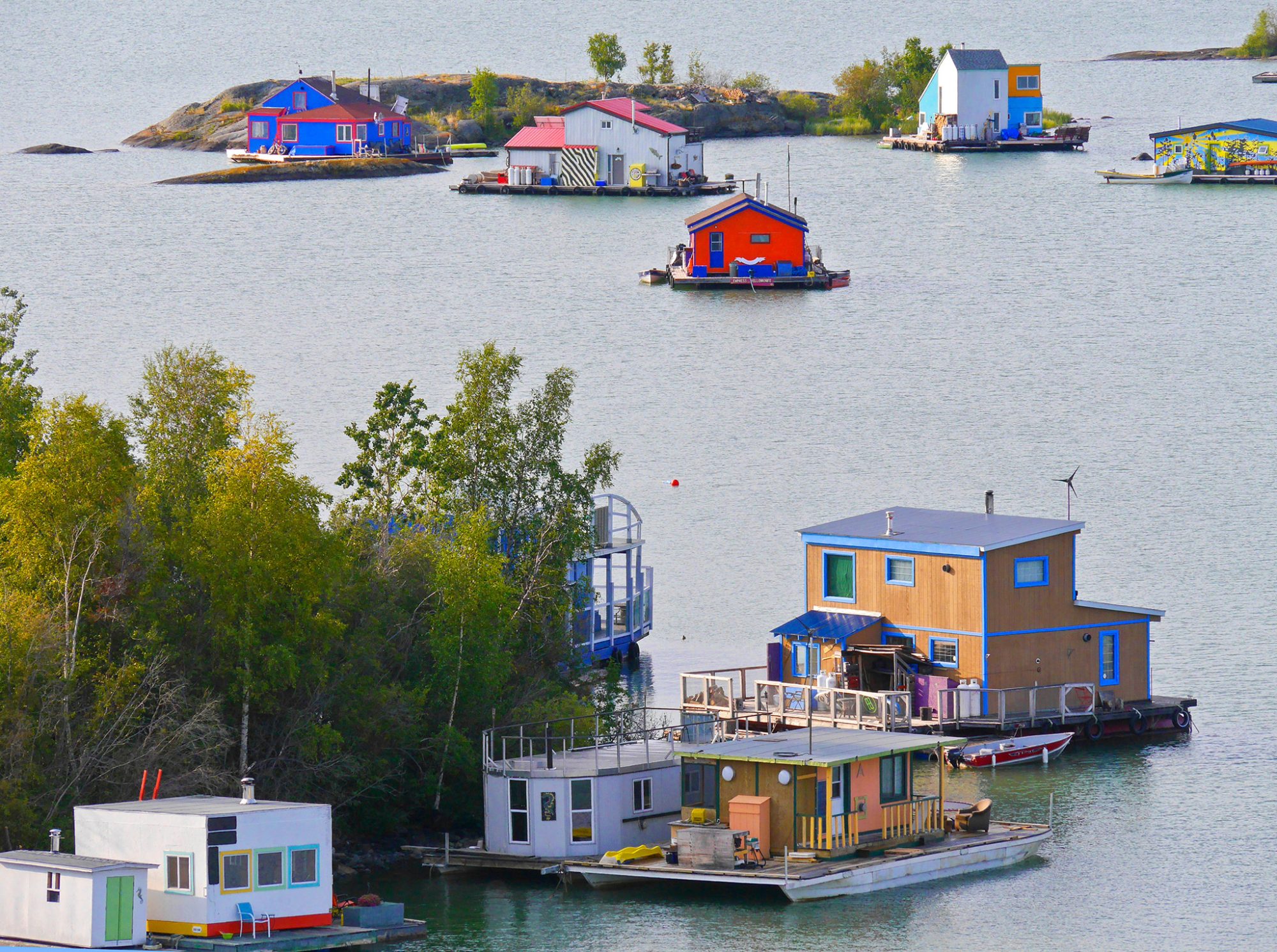 Colorful houseboats on calm water