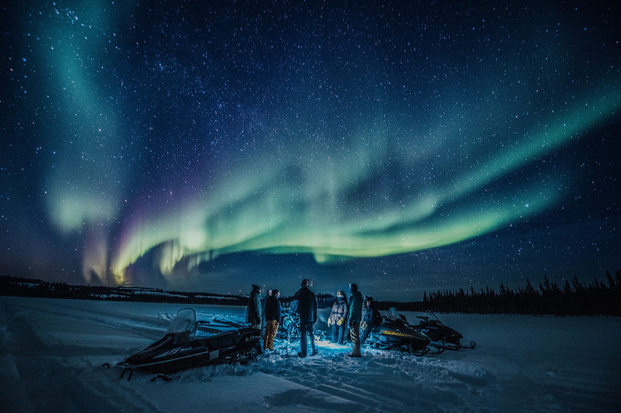 People watching northern lights at night