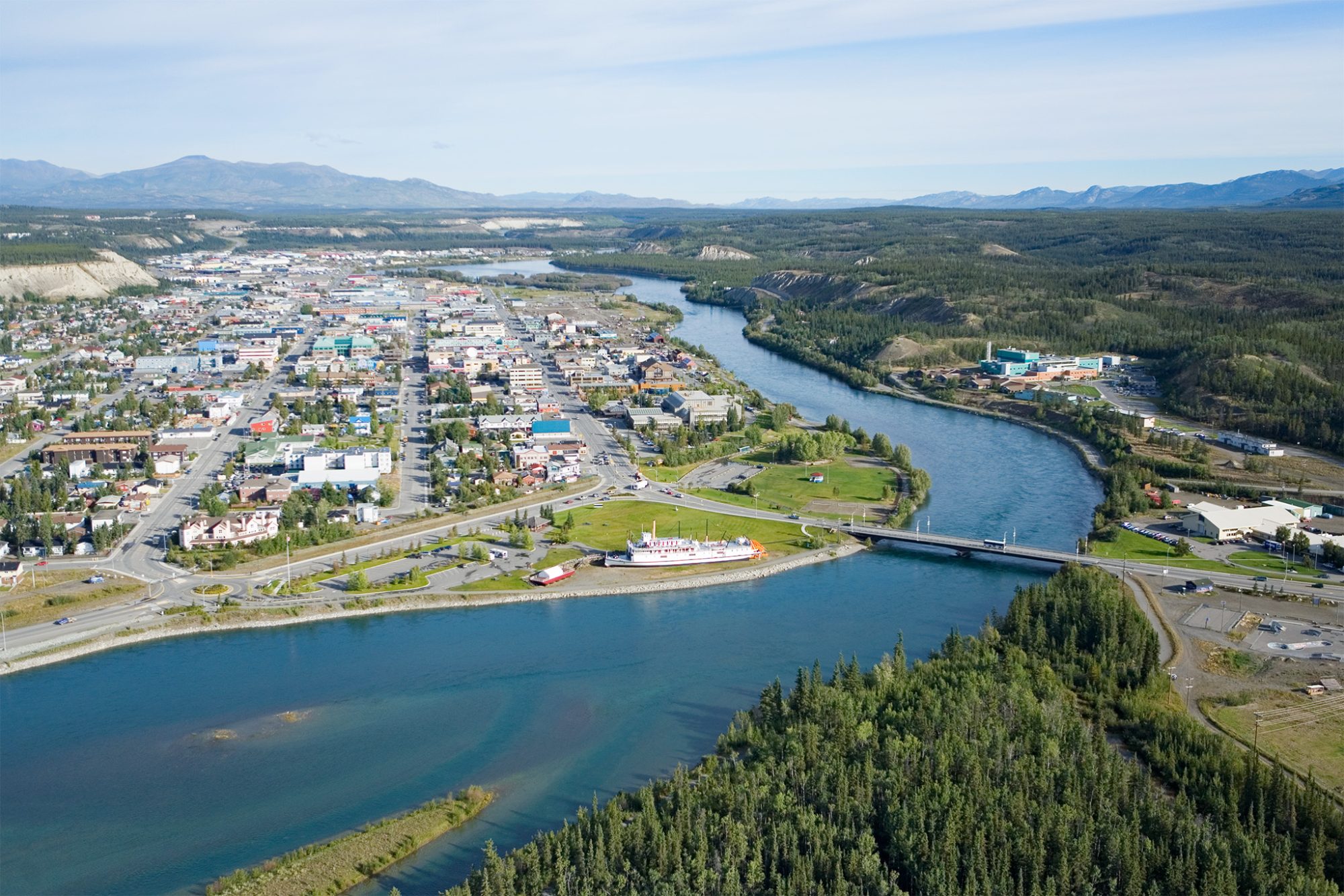 Aerial view of a riverside town.