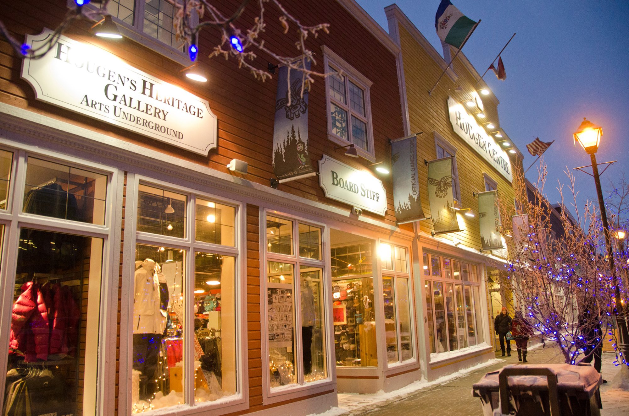 Shops illuminated in winter evening