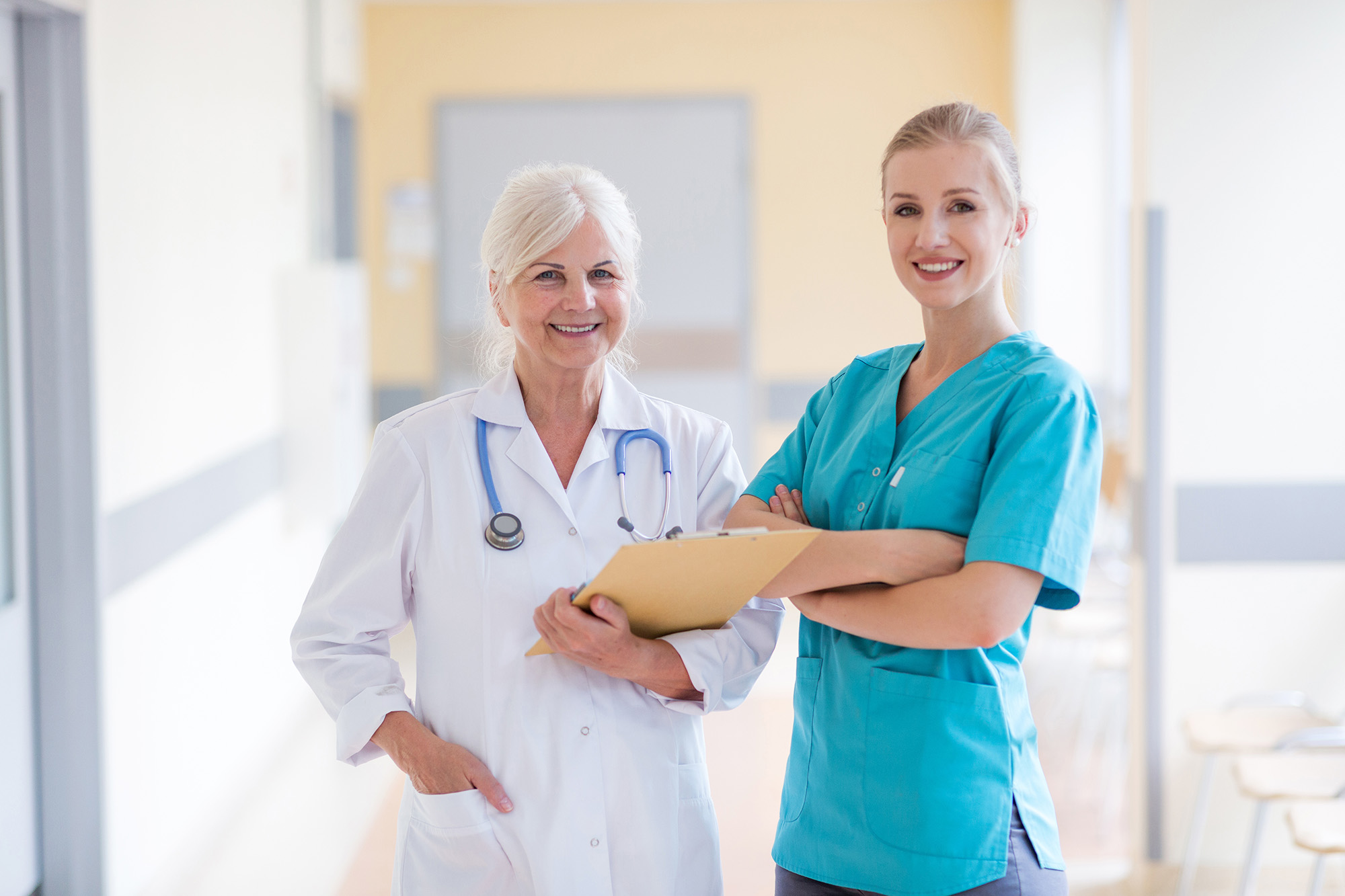 Two healthcare professionals smiling together.